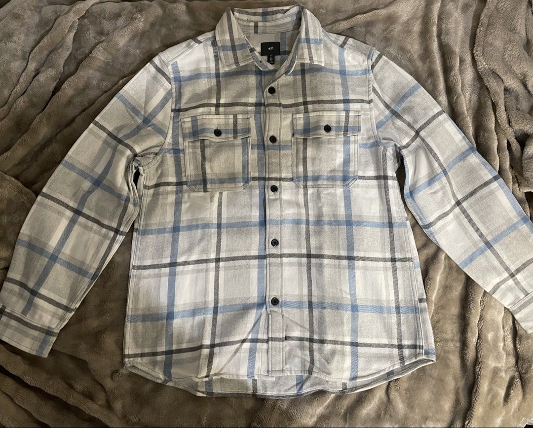 H&M Twill overshirt_Light blue/Grey checked (Category: Coats, Jackets and Outerwear) located in Manila. Submitted by gildoisgreat (Listing ID 1465045710, Image 1). Description: - Brand: H&M - Style: Flannel button-up shirt in white, grey, and blue plaid - Size: L (185/108A) - Features: Long sleeves with button cuffs, standard front buttons, two chest pockets - Condition: Excellent, perfect for easy everyday layering - Shipping or meet-up options 