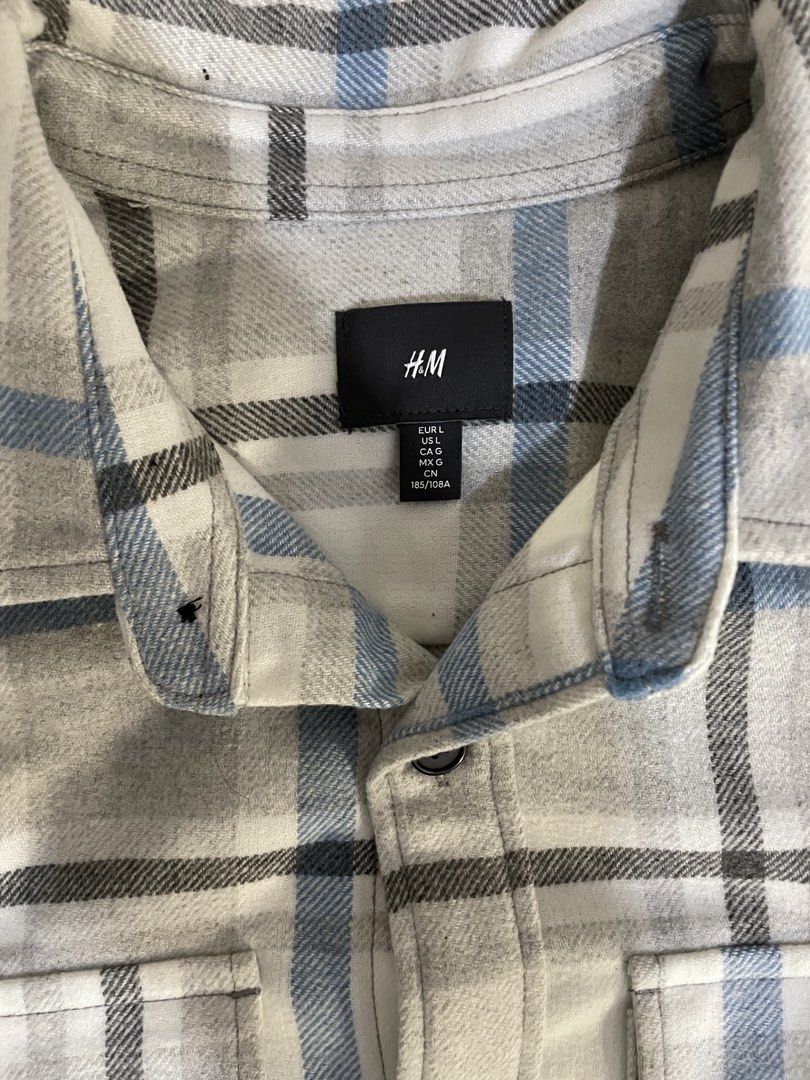 H&M Twill overshirt_Light blue/Grey checked (Category: Coats, Jackets and Outerwear) located in Manila. Submitted by gildoisgreat (Listing ID 1465045710, Image 2). Description: - Brand: H&M - Style: Flannel button-up shirt in white, grey, and blue plaid - Size: L (185/108A) - Features: Long sleeves with button cuffs, standard front buttons, two chest pockets - Condition: Excellent, perfect for easy everyday layering - Shipping or meet-up options 