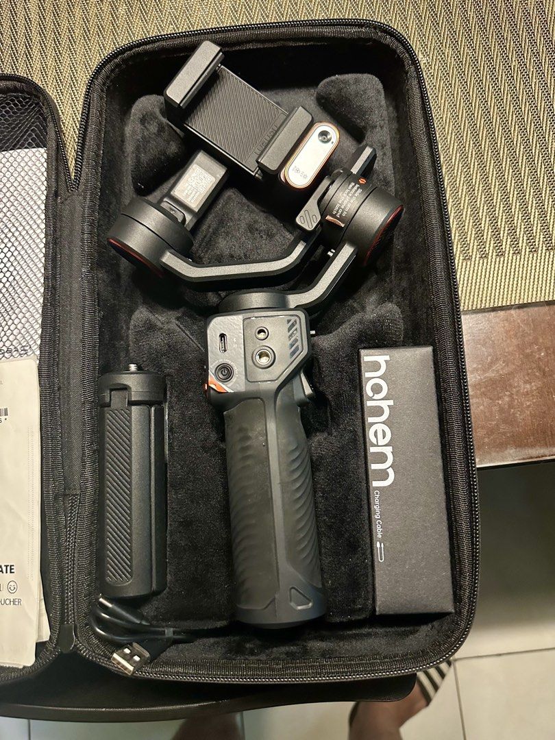 Hohem iSteady M6 Smartphone Gimbal Stabilizer (Category: Gimbals & Stabilizers ) located in Manila. Submitted by olxph_jeffr6014 (Listing ID 1465055235, Image 1). Description: - Model: Hohem iSteady M6 3-Axis Smartphone Gimbal Stabilizer Kit - Condition: Clean, powers on normally, but, NEED TO REPLACE LCD - Inclusions: Main gimbal unit, tripod stand, charging cable box, and manual booklet - Storage: Original hardshell carry case with custom molde