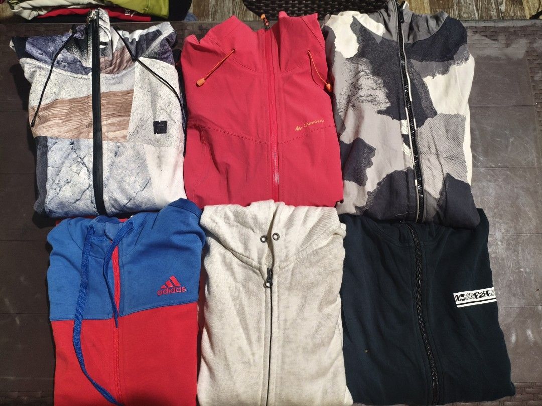 Hoodie Jackets ‼️ (Category: Coats, Jackets and Outerwear) located in Baguio. Submitted by zayneshop (Listing ID 1465053766, Image 2). Description: - Quantity: Bundle of 6 zip-up hoodies and jackets - Brands included: Adidas, Quechua, and more - Styles & Prints: Colourblock, abstract patterns, and solid brights in various colours - Perfect for: Cooler weather and casual wear - Value deal: Get the whole set at once!.