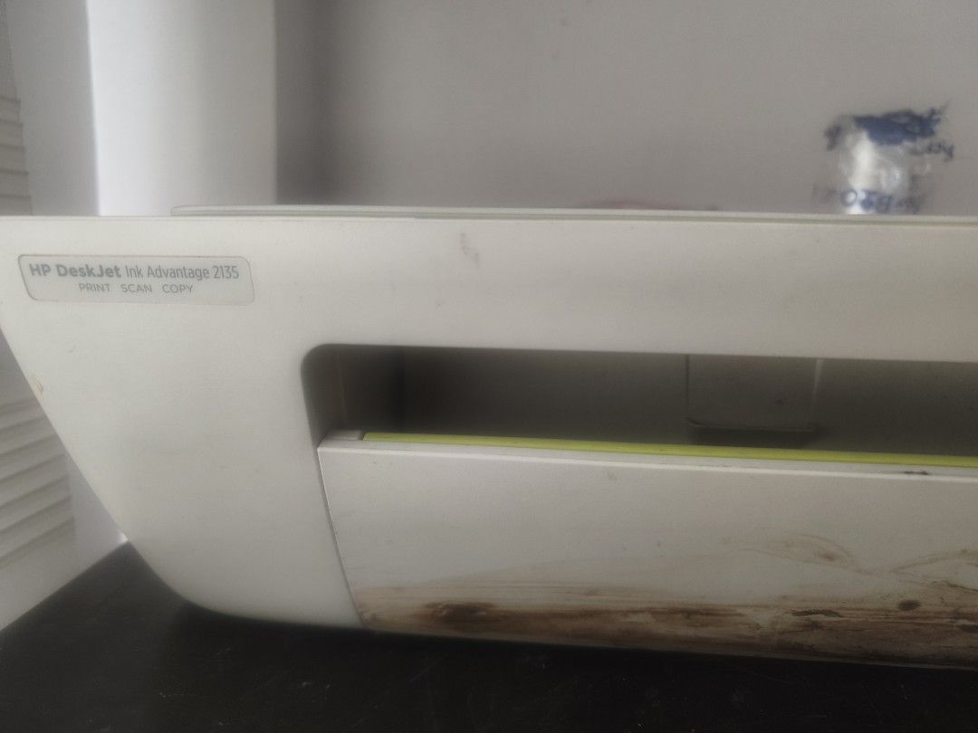 HP DeskJet Ink Advantage 2135 Print Scan Copy (Category: Printers, Scanners & Copiers) located in Taguig. Submitted by pjcute (Listing ID 1464984435, Image 1). Description: - Model: HP DeskJet Ink Advantage 2135 All-in-One Printer - Functions: Print, scan, and copy - Condition: Powers on and functions normally; has minor stains and marks near the bottom front tray area - Inclusions: Printer and power cable only - Ideal for: Budget-friendly home o