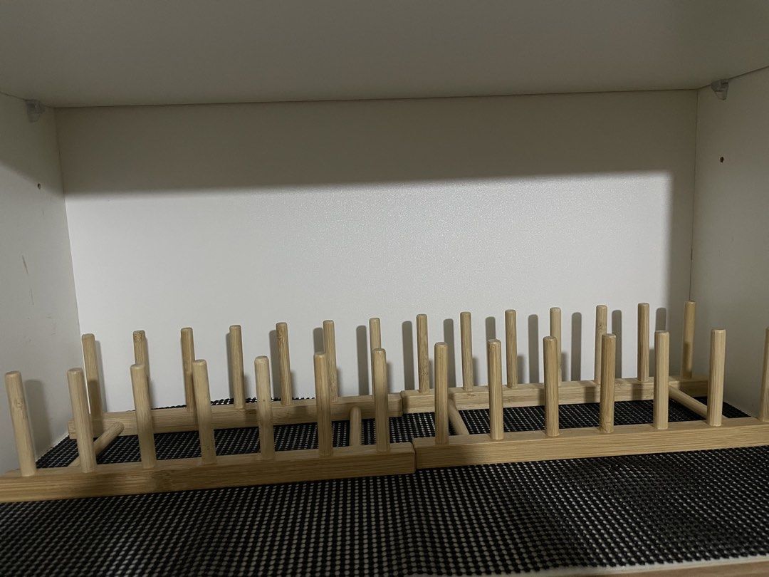 IKEA Wooden plate/dish organizer (Category: Food Organization & Storage) located in Mandaluyong City. Submitted by mhaeydeclutters (Listing ID 1464990166, Image 1). Description: - Material: Light bamboo wood - Design: Vertical pegs for keeping plates, bowls, or pot lids neatly separated and upright - Fit: Designed to fit standard kitchen cabinet shelves - Benefit: Maximizes kitchen storage space and helps organize dishes efficiently after washing