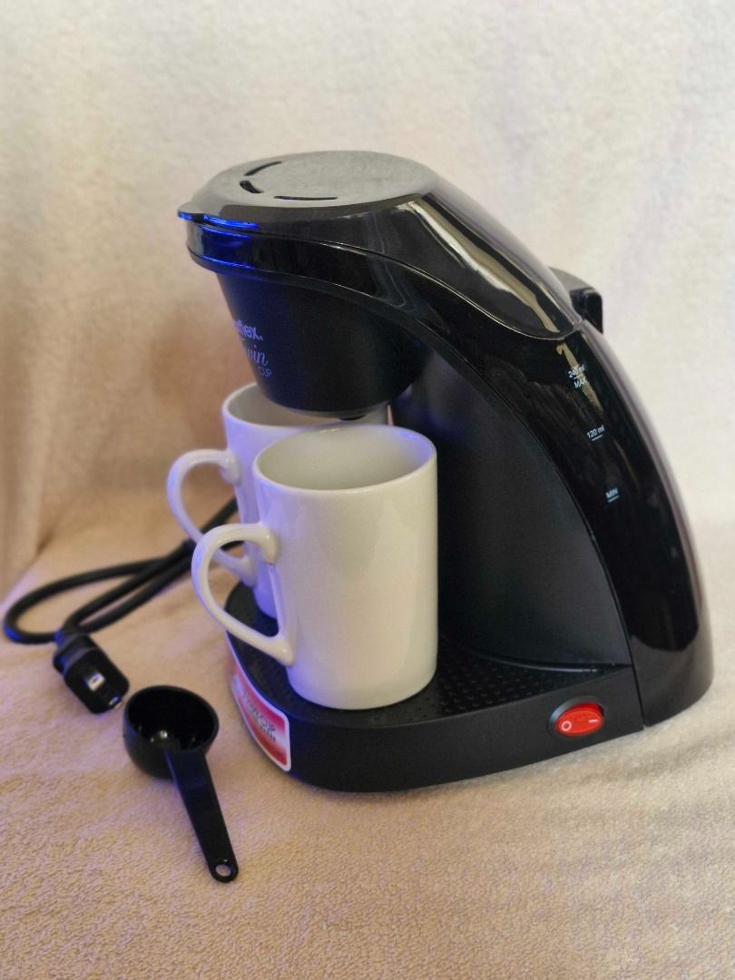 Imarflex Twin Cup Coffee Maker (Category: Coffee Machines & Makers) located in Davao. Submitted by j_guitarist (Listing ID 1465025403, Image 2). Description: - Brand: Imarflex - Brews two 125ml cups simultaneously with an auto-drip system - Includes two matching white ceramic mugs - Comes with a black measuring spoon - Original box included - Excellent working condition - Perfect for couples or individuals looking for a quick, compact brew.