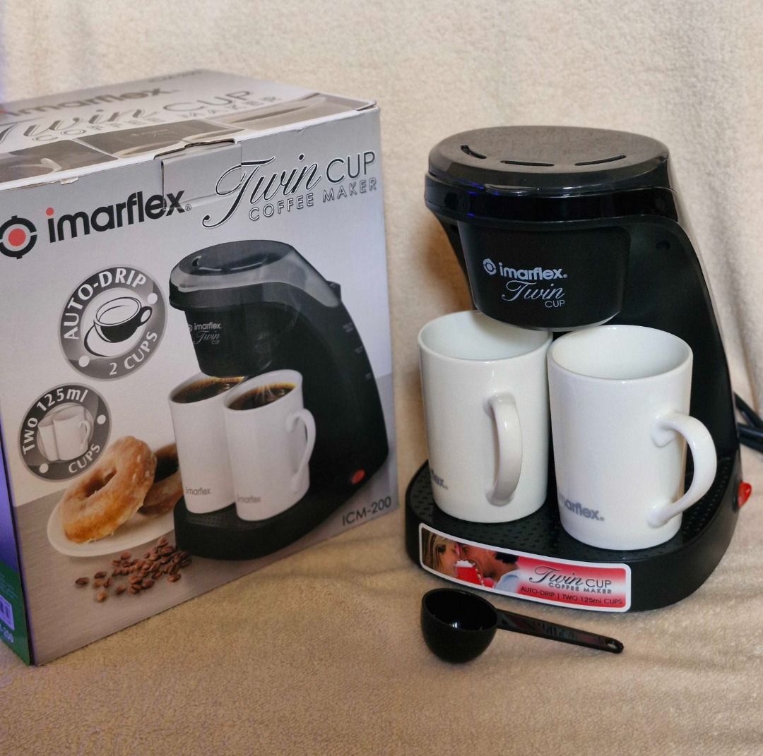 Imarflex Twin Cup Coffee Maker (Category: Coffee Machines & Makers) located in Davao. Submitted by j_guitarist (Listing ID 1465025403, Image 1). Description: - Brand: Imarflex - Brews two 125ml cups simultaneously with an auto-drip system - Includes two matching white ceramic mugs - Comes with a black measuring spoon - Original box included - Excellent working condition - Perfect for couples or individuals looking for a quick, compact brew.