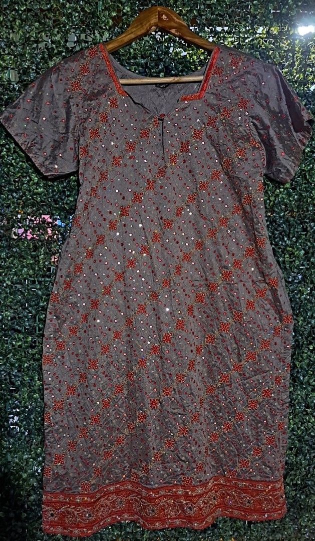 Indian Grey Kurti with Red Embroidery and Sequin Work (Category: Blouses) located in Batangas. Submitted by yanaspreloved1 (Listing ID 1464984983, Image 1). Description: - Material: Comfortable grey cotton - Design: Square neckline, short sleeves, and a small front button - Details: All-over red embroidered motifs with reflective sequins and a wide embroidered red hemline - Length: Knee-length with a relaxed, comfortable fit - Occasion: Ideal for