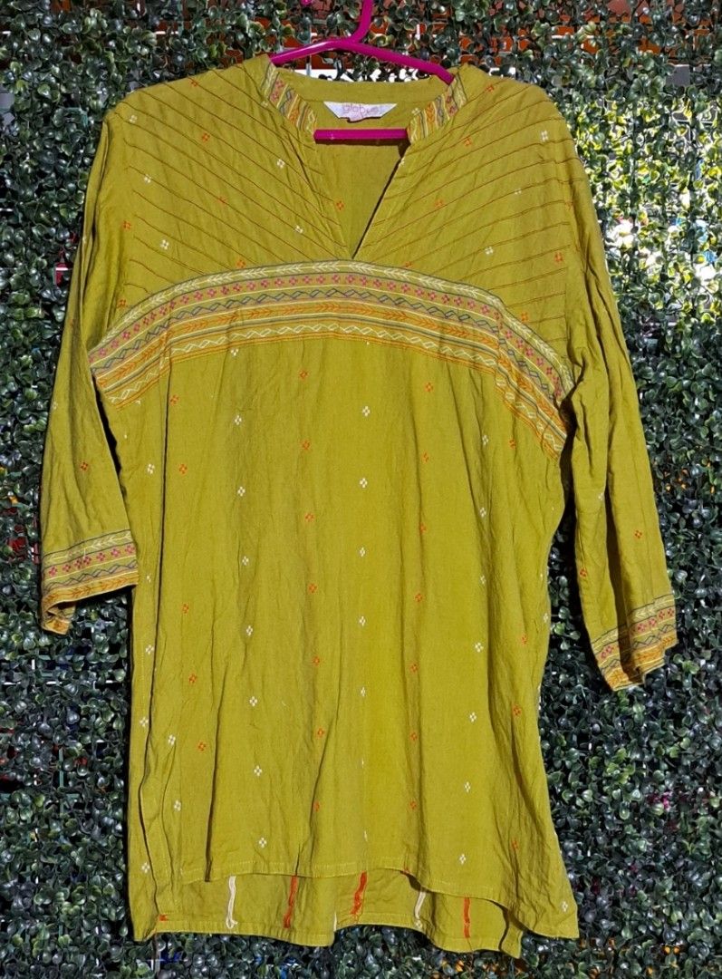 Indian Kurti Globus Mustard Yellow Patterned Tunic (Category: Blouses) located in Batangas. Submitted by yanaspreloved1 (Listing ID 1464986470, Image 1). Description: - Brand: Globus - Color: Mustard yellow - Fit: Relaxed and lightweight, great with jeans or leggings - Neckline: V-neck with striped accents - Sleeves: Three-quarter sleeves with patterned trim - Details: Traditional printed chest and collar design with all-over small embroidered mo