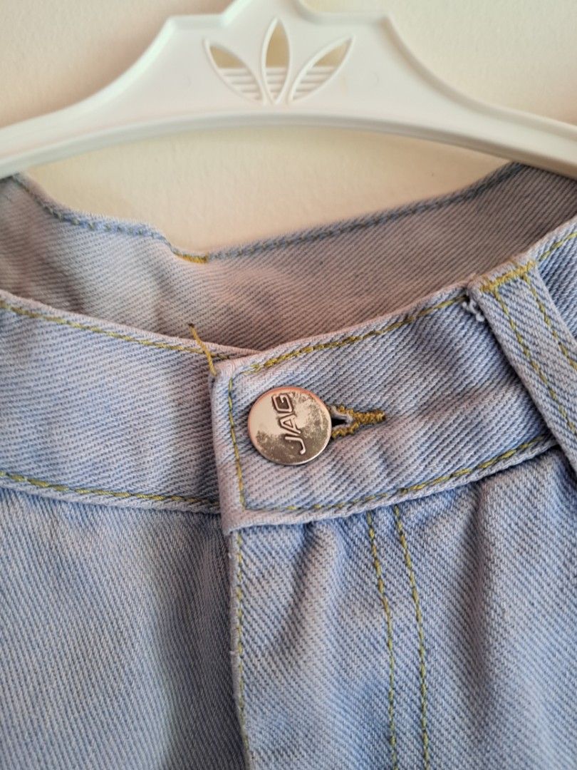 JAG Light Blue Denim Jeans (Category: Jeans) located in Manila. Submitted by yselles__ (Listing ID 1464981910, Image 3). Description: - Brand: JAG - Color/Wash: Light wash blue denim - Fit: Mid rise, classic straight leg - Details: Contrast yellow stitching, branded metal button closure, back leather patch, and iconic red logo tab - Condition: Clean, minimal signs of wear - Style: Versatile everyday wardrobe staple.