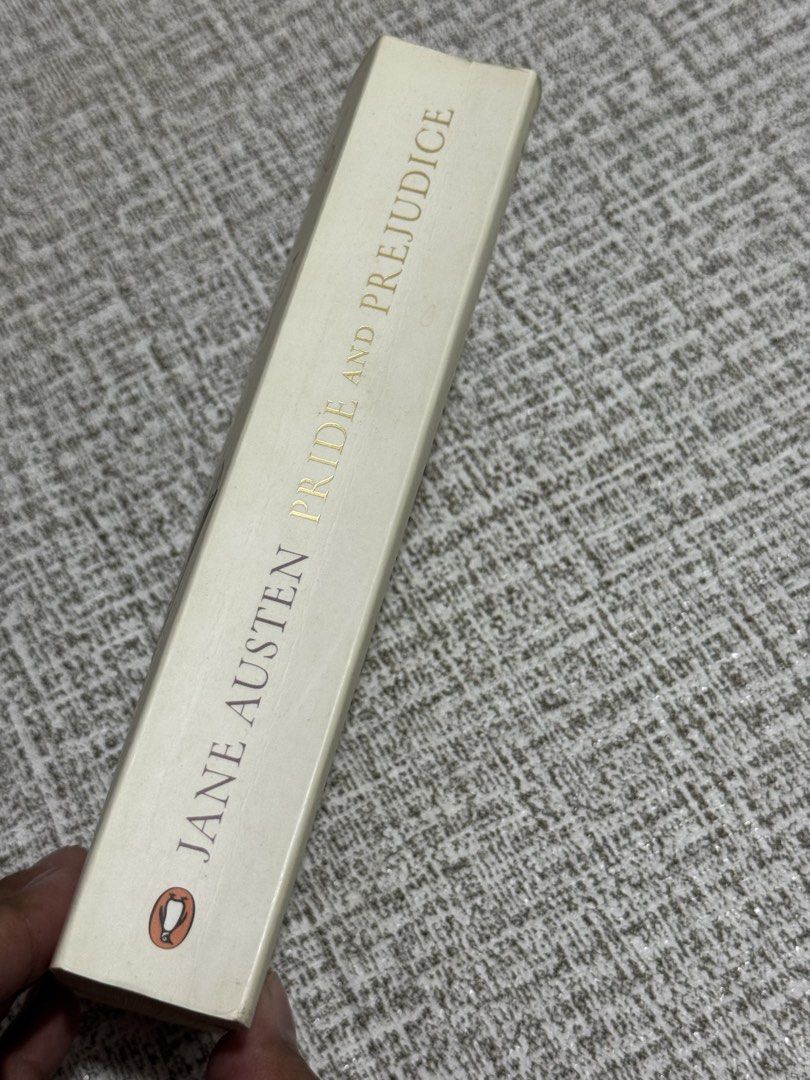 Jane Austen Pride and Prejudice Penguin Red Classics Paperback (Category: Storybooks) located in Cavite. Submitted by yourpahinagirly (Listing ID 1464990612, Image 2). Description: - Title: Pride and Prejudice by Jane Austen - Edition: Penguin Red Classics (Paperback with cover illustration) - Condition: Pre-loved with natural yellowing/tanning along the page edges - Wear & Tear: Minor creasing near the spine and corners, with some wear marks on 