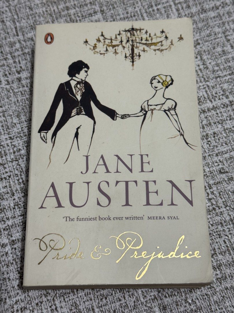 Jane Austen Pride and Prejudice Penguin Red Classics Paperback (Category: Storybooks) located in Cavite. Submitted by yourpahinagirly (Listing ID 1464990612, Image 1). Description: - Title: Pride and Prejudice by Jane Austen - Edition: Penguin Red Classics (Paperback with cover illustration) - Condition: Pre-loved with natural yellowing/tanning along the page edges - Wear & Tear: Minor creasing near the spine and corners, with some wear marks on 