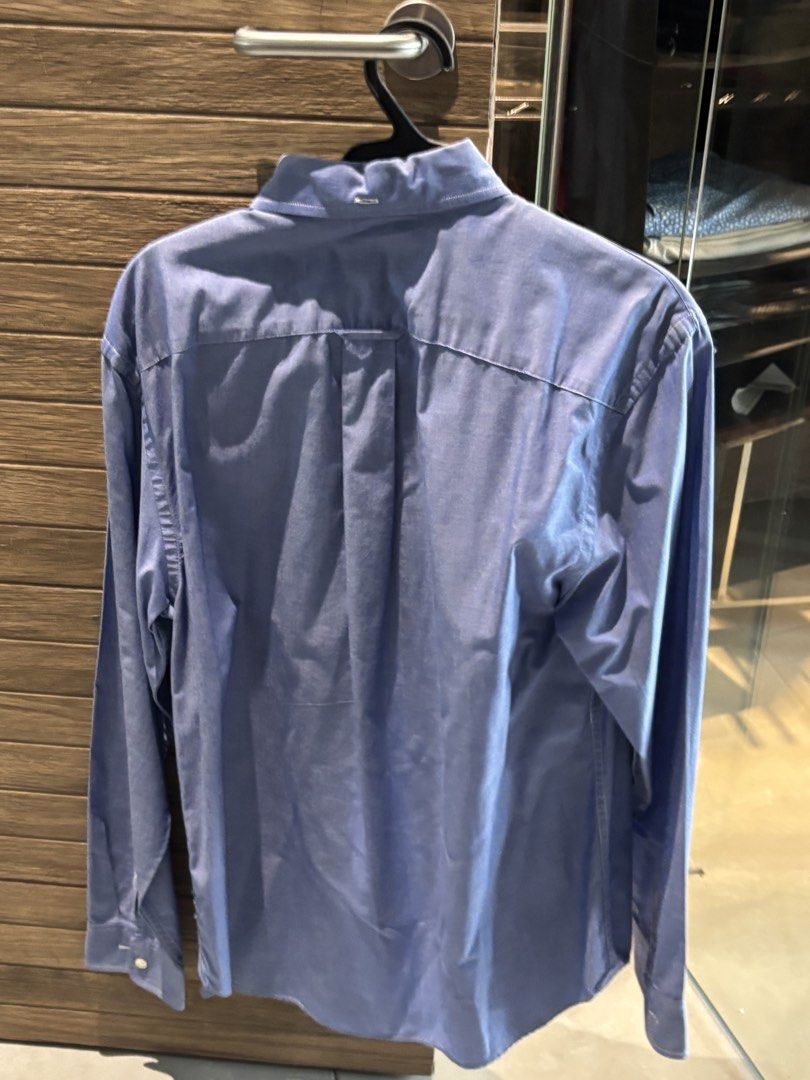 JCP Blue Long Sleeve Button-Down Polo Long Sleevd Shirt Size M (Category: Tshirts & Polo Shirts ) located in Quezon City. Submitted by tanmiguel1998 (Listing ID 1464996906, Image 3). Description: - Brand/Item: jcp Blue Long Sleeve Button-Down Shirt - Size: Medium (Regular Fit) - Origin: Made in Mauritius - Design Details: Button-down collar, left chest pocket, and back pleat for easy movement - Material: Sturdy, comfortable, and durable fabric - 