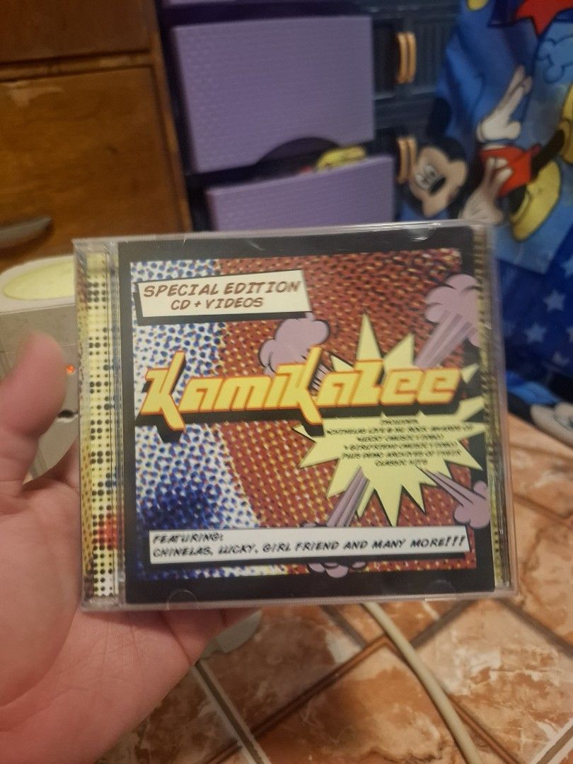 Kamikazee Special Edition Audio and Video CD (Category: CDs & DVDs) located in San Jose del Monte. Submitted by youweiner48495 (Listing ID 1465006664, Image 1). Description: - Artist & Title: Kamikazee Special Edition CD & AVCD - Art Style: Cool comic book pop art cover design - Tracklist Highlights: Includes OPM hits like Chinelas, Lucky, and Girl Friend - Bonus Features: Includes live performances and music videos - Condition: Disc surface is c