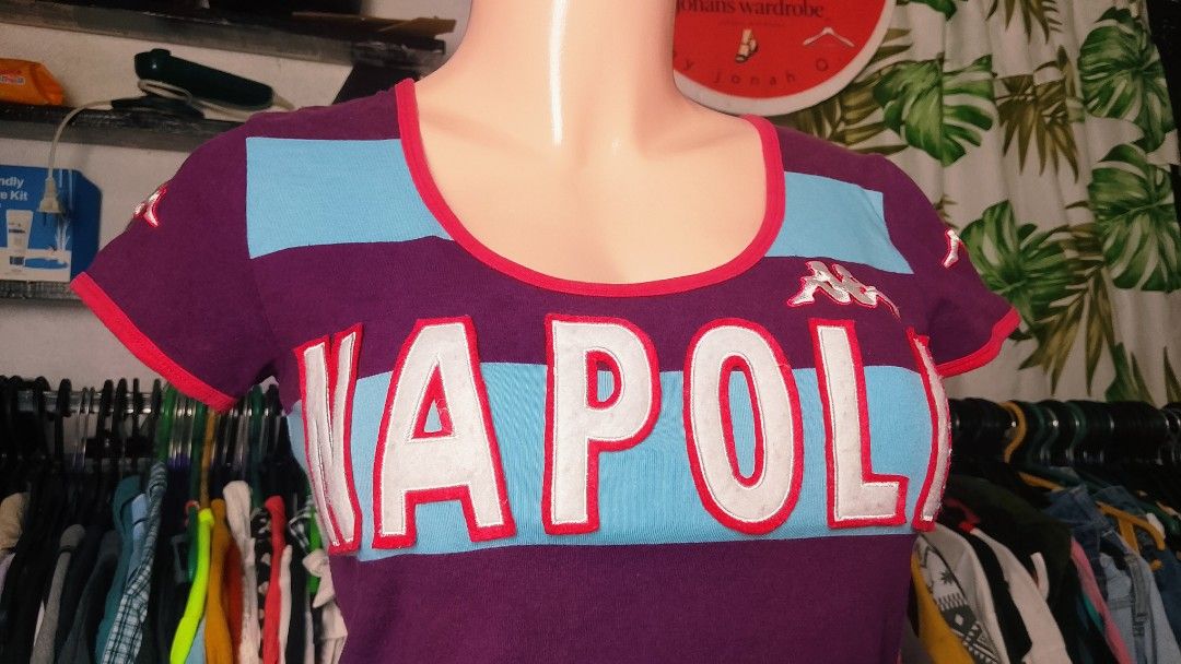 Kappa Napoli Striped Tee & Track Pants Set (Category: Sets or Coordinates) located in Manila. Submitted by jonahq.9 (Listing ID 1465082481, Image 3). Description: - Authentic Kappa matching set - Striped short-sleeve top with scoop neckline and red trim - Bold Napoli lettering across the chest - Kappa logo embroidery on the shoulder, chest, and pants pocket - Comfortable dark trousers included - Great streetwear or sporty look.