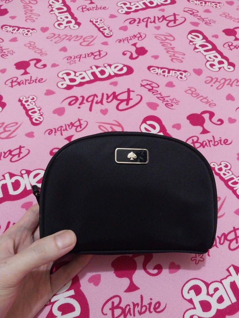 Kate Spade Dawn Small Dome Cosmetic Black (Category: Purses & Pouches) located in Manila. Submitted by PrinceDani.Clothing (Listing ID 1465050134, Image 2). Description: - Authentic Kate Spade cosmetic pouch in classic black - Durable and lightweight nylon material with a dome shape - Elegant gold-tone hardware and signature metal spade logo plaque - Premium leather zipper pull for easy opening - Immaculate interior and exterior with zero signs o