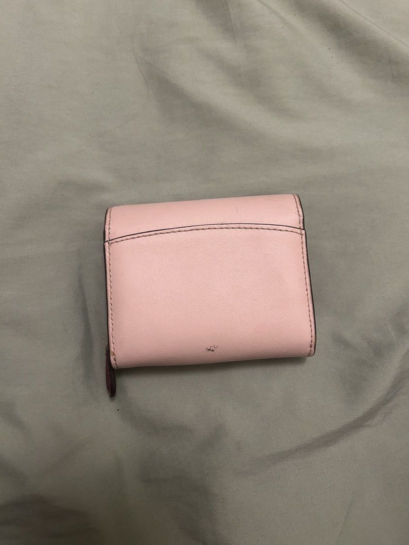 Kate Spade Pink Scallop Wallet (Category: Wallets & Card holders) located in Hermosa. Submitted by dlwrlma00 (Listing ID 1465088904, Image 2). Description: - Brand: Kate Spade - Style: Bifold wallet with chic scalloped flap closure - Color: Pink exterior with a rich deep burgundy interior - Compartments: Multiple card slots, slip pockets, and a secure zippered coin compartment - Hardware & Branding: Elegant gold-tone foil branding stamped on the 