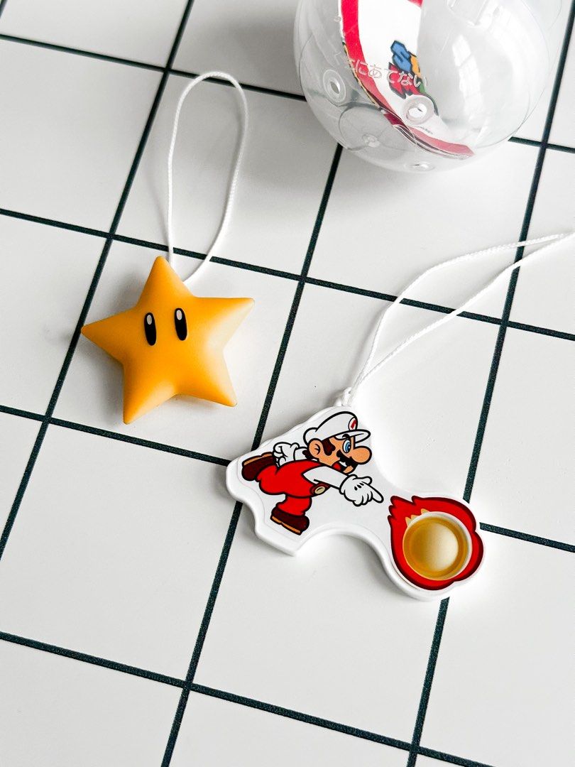 Kinder Joy Super Mario Star and Fire Mario Set (Category: Character Goods) located in Makati City. Submitted by larkvain (Listing ID 1464980091, Image 2). Description: - Kinder Joy Nintendo Super Mario - Includes Super Star strap and Fire Mario action charm with bubble popper feature - Comes complete with clear capsule container and original paper insert - Great addition to any Nintendo collection.