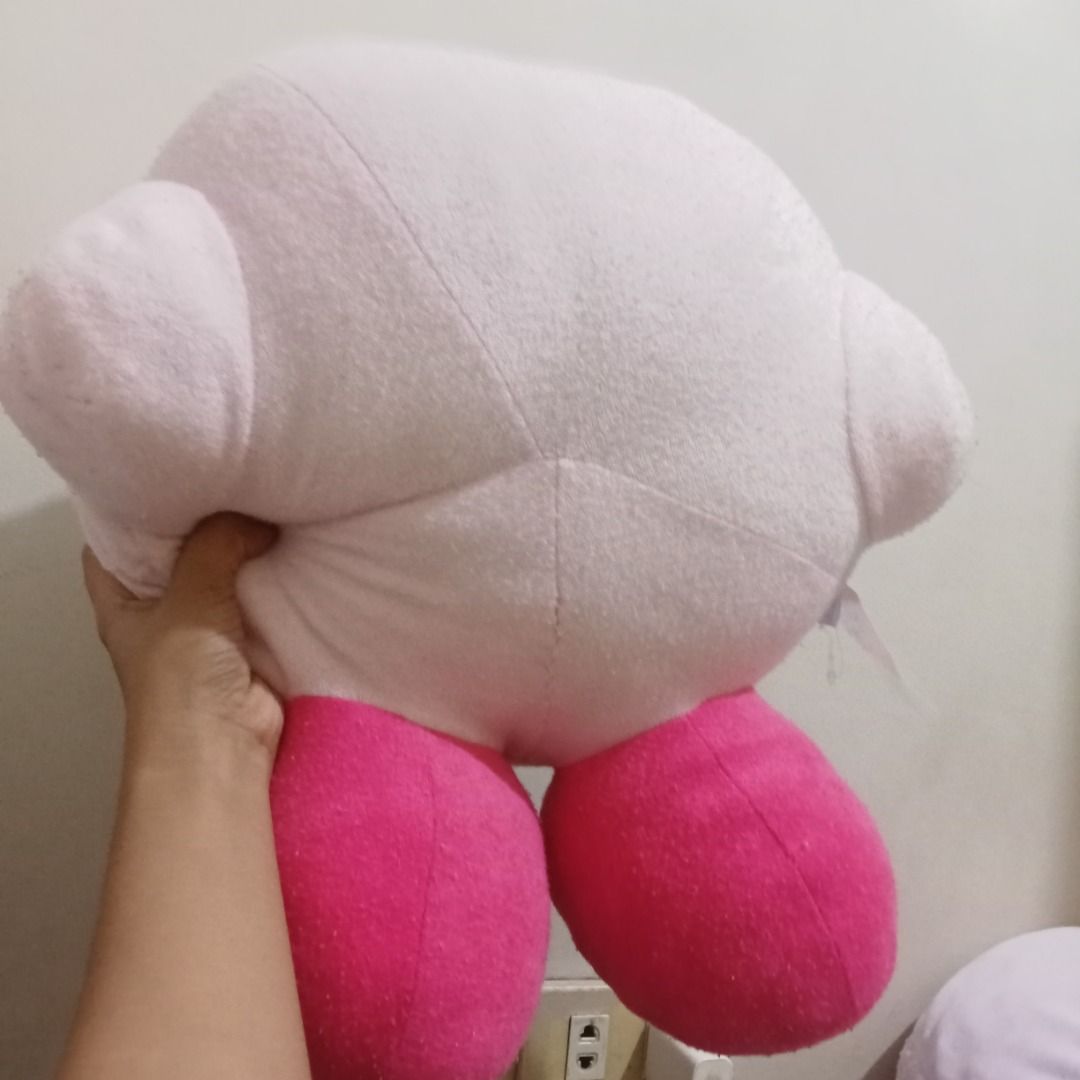 Kirby plush big size (Category: Plushies & Soft Toys) located in Quezon City. Submitted by trinket_cat (Listing ID 1464992459, Image 3). Description: - Item: Authentic soft pink Kirby plushie pillow - may himulmol -not brand new - with etiketa.