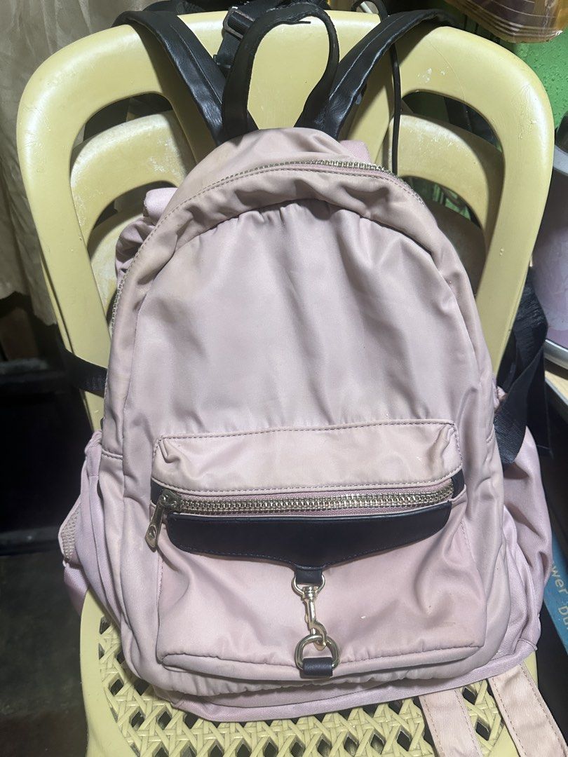 KissMe Couture Pink Backpack (Category: Backpacks) located in Manila. Submitted by edgiedge (Listing ID 1465060704, Image 1). Description: Chic pink nylon backpack featuring contrasting black straps, gold-tone hardware, and a cute front D-ring clasp. The interior boasts bright pink lining and a unique lips-shaped logo patch. Please note there are some white stains near the bottom and inside pocket. Perfect for casual everyday use! ₱200.