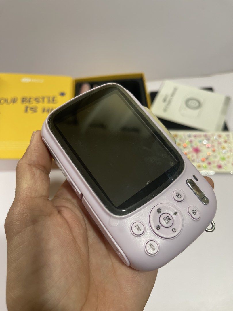 Kit Beez KF-3 Digital Camera Purple (Category: Cameras) located in Cavite. Submitted by moon_beam_22 (Listing ID 1465101687, Image 3). Description: - Model: Kit Beez KF-3 Compact Digital Camera - Color: Purple - Condition: Tested and fully working, including flash - Inclusions: Original yellow box, user manual, charging cable, pouch, memory card, and decorative sticker sheet - Ideal for: Everyday photography, casual snaps, or as a ready-to-gift i