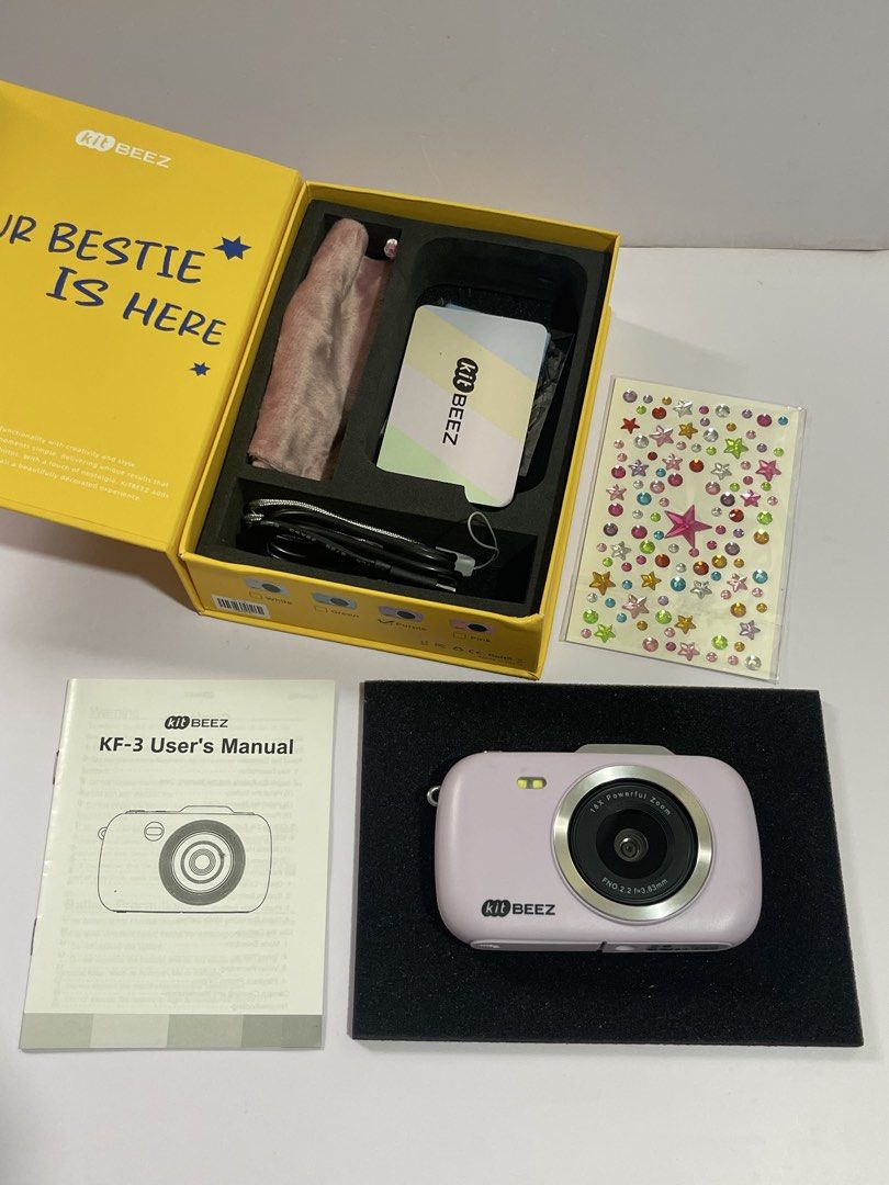 Kit Beez KF-3 Digital Camera Purple (Category: Cameras) located in Cavite. Submitted by moon_beam_22 (Listing ID 1465101687, Image 2). Description: - Model: Kit Beez KF-3 Compact Digital Camera - Color: Purple - Condition: Tested and fully working, including flash - Inclusions: Original yellow box, user manual, charging cable, pouch, memory card, and decorative sticker sheet - Ideal for: Everyday photography, casual snaps, or as a ready-to-gift i