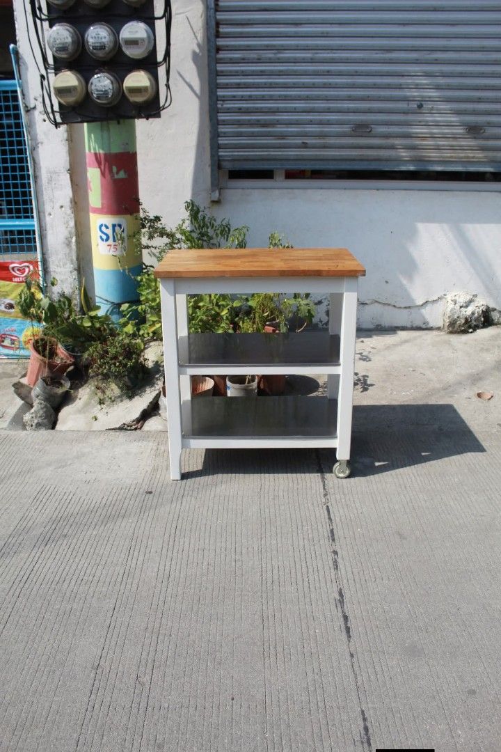 Kitchen counter space (Category: Other Home Furniture) located in Meycauayan. Submitted by marygracecasimiro (Listing ID 1465164827, Image 3). Description: IKEA STENSTORP Kitchen Island Solid wood butcher-block top, two stainless steel storage shelves and a sturdy off-white frame. Equipped with casters for easy mobility. Perfect for food preparation, storage or extra kitchen counter space L:31 • W:20 • H:35 ¼ inches 7,900 pesos only💚 5,900 sale 