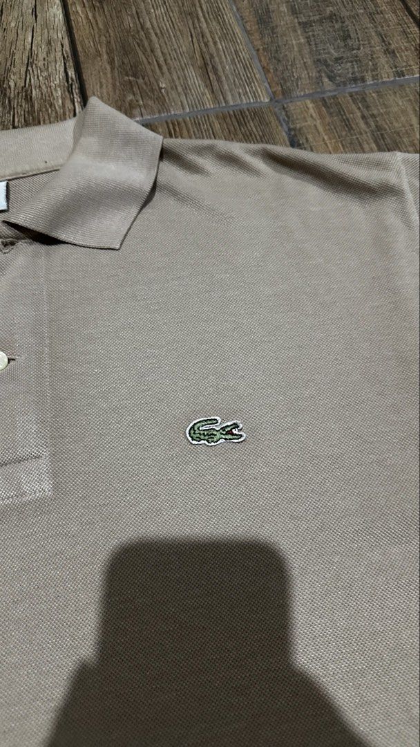 LACOSTE BROWN POLO (Category: Tshirts & Polo Shirts ) located in Manila. Submitted by urban.vintage (Listing ID 1464973313, Image 2). Description: ISSUE: CROPPED (NEED WASH) MOP :GCASH (NO COD) SHIP VIA: LALAMOVE & J&T LOCATION: PASIG CITY LENGTH: 26 WIDTH :23.