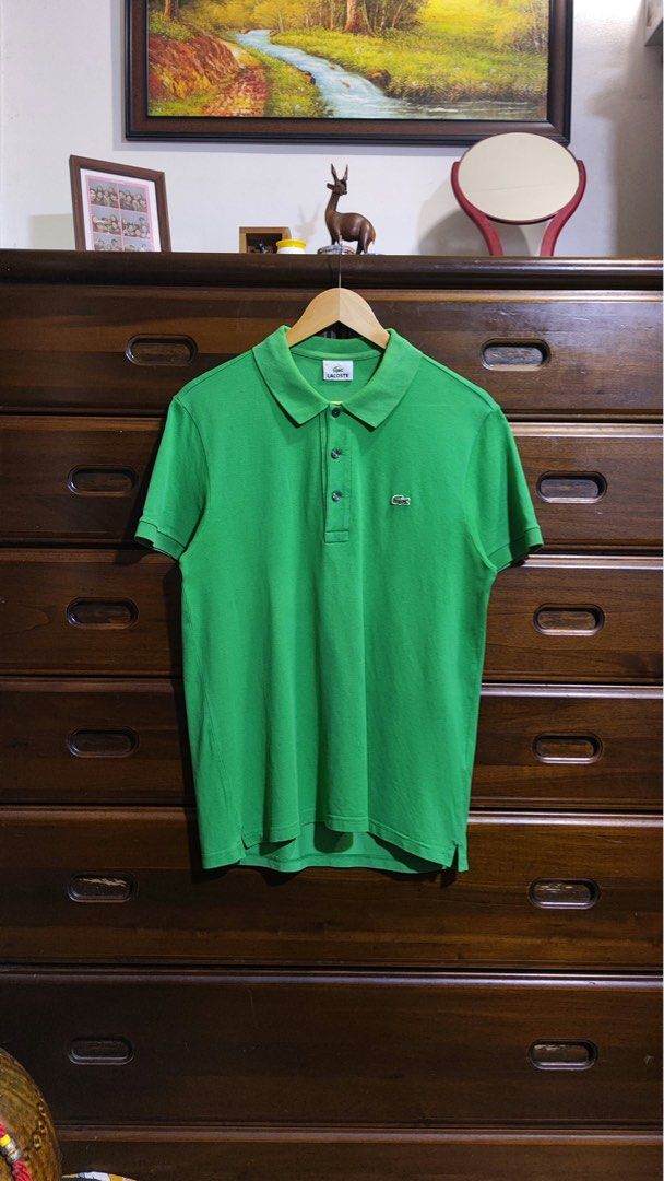 Lacoste Green Polo Shirt Size 4 (Category: Tshirts & Polo Shirts ) located in Manila. Submitted by coollion.5d785a (Listing ID 1465072190, Image 1). Description: - Brand: Lacoste - Style: Classic cotton pique polo shirt - Color: Green - Size: 4 - Details: Ribbed collar and cuffs, 3-button placket with dark buttons, iconic embroidered green crocodile logo on chest - Condition: Clean and well-maintained.