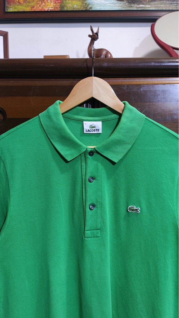 Lacoste Green Polo Shirt Size 4 (Category: Tshirts & Polo Shirts ) located in Manila. Submitted by coollion.5d785a (Listing ID 1465072190, Image 3). Description: - Brand: Lacoste - Style: Classic cotton pique polo shirt - Color: Green - Size: 4 - Details: Ribbed collar and cuffs, 3-button placket with dark buttons, iconic embroidered green crocodile logo on chest - Condition: Clean and well-maintained.