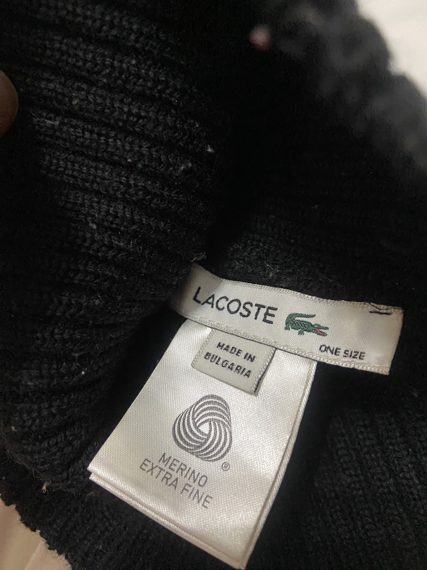 Lacoste Merino Extra Fine Black Beanie One Size (Category: Caps & Hats) located in Pilar. Submitted by romeoabejo54125 (Listing ID 1464983712, Image 2). Description: - Brand: Lacoste - Color: Classic Black - Material: Extra Fine Merino Wool (Made in Bulgaria) - Design: Ribbed knit texture with iconic green crocodile logo patch - Fit: One size fits most - Condition: Brand new / Soft and warm for cold weather.