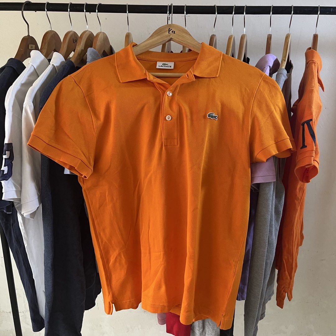 Lacoste Orange Polo Shirt Size 4 (Category: Tshirts & Polo Shirts ) located in Sagbayan (Borja). Submitted by lunapawpaw46843 (Listing ID 1465094597, Image 1). Description: - Brand: Lacoste - Color: Bright orange - Size: Men's 4 - Material: Classic cotton pique - Features: Two-button placket, standard collar, short sleeves, and embroidered green crocodile logo - Condition: Clean and ready to wear.