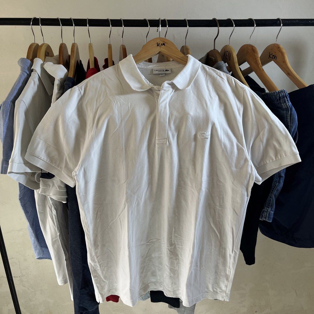 Lacoste Regular Fit White Polo Shirt (Category: Tshirts & Polo Shirts ) located in Sagbayan (Borja). Submitted by lunapawpaw46843 (Listing ID 1465049368, Image 1). Description: - Brand: Lacoste - Color: Classic White - Fit: Regular fit - Material: Premium cotton petit pique - Details: Collar neck, short button placket, tonal embroidered crocodile logo on chest - Condition: Excellent, from a clean wardrobe clearout - Styling: Versatile piece that 