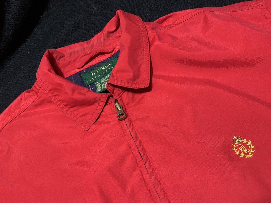 Lauren Ralph Lauren 90s crest harrington jacket(Authentic) (Category: Coats, Jackets and Outerwear) located in Cagayan de Oro. Submitted by chabermz (Listing ID 1465106591, Image 3). Description: - Brand/Model: Lauren Ralph Lauren Zip-Up Jacket - Size: Medium - Color: Bright red with dark blue plaid cotton lining - Hardware: Gold-tone zipper pull with YKK hardware - Details: Embroidered logo crest on left chest, ribbed elastic cuffs and hem - Sto