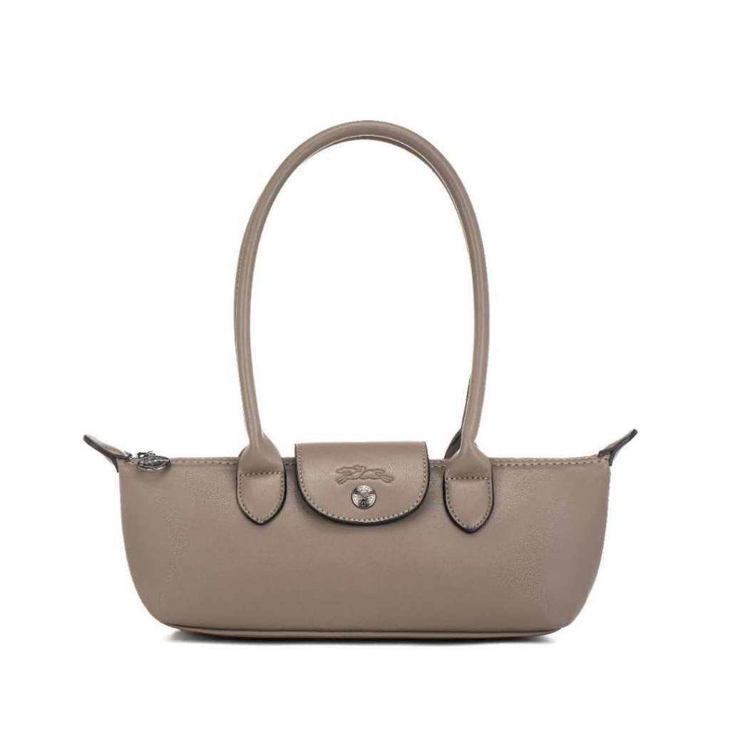 LC Extra Long Handle Handbag (Category: Luxury Bags & Wallets) located in Davao. Submitted by nisa_chan04 (Listing ID 1465101798, Image 1). Description: - Authentic Longchamp Le Pliage bag with extra-long handles - Secure zip-top closure with leather snap flap and embossed horse logo - Compact horizontal shape with dual structured carry handles - Practical everyday design with a clean silhouette - Available in versatile colors: taupe, brown, blac