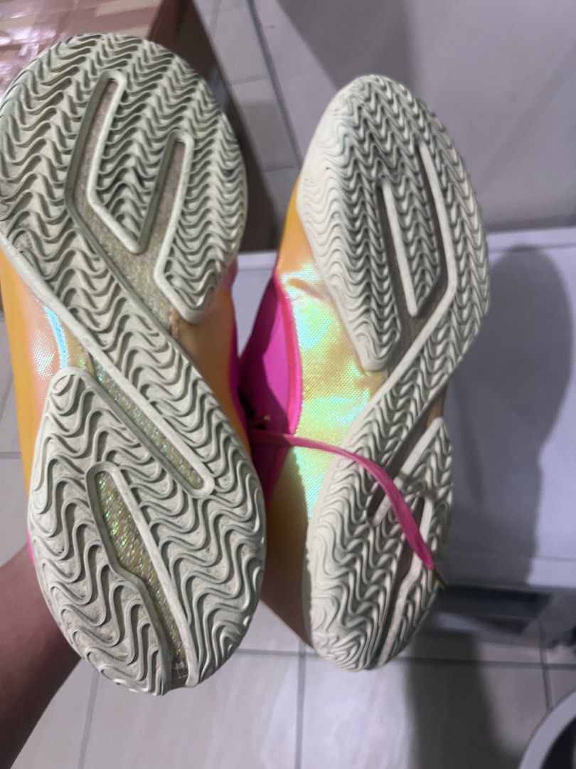 Lebron size 12 (Category: Sneakers) located in Quezon City. Submitted by albz45 (Listing ID 1465030338, Image 3). Description: - Brand: Nike - Colorway: Bright pink and yellow with metallic gold gradient - Details: Pink laces with green accents - Condition: Pre-loved with minor scuffs, dust marks, and tread wear from court use - Best for: Outdoor hoops or casual street style - Location: Ships from Philippines / Meetups available.