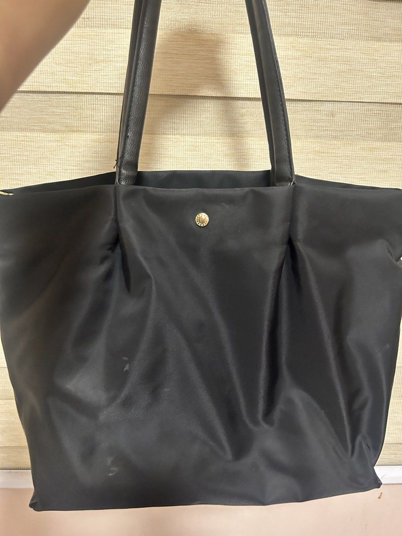 Original Legato Largo Large Tote Shoulder Bag (Category: Tote Bags) located in Guiguinto. Submitted by exhoardergirl (Listing ID 1465105158, Image 1). Description: - Color & Material: Black nylon with gold hardware accents - Style: Everyday tote bag with dual black shoulder straps - Closure: Top snap button - Interior: Roomy with multiple zippered compartments and slip pockets - Condition: Clean lining inside, minor wear on the outer nylon fabric