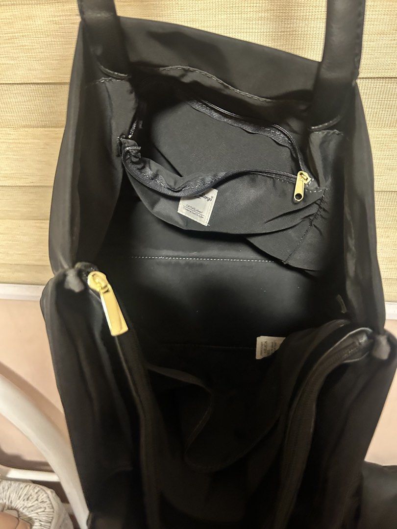Original Legato Largo Large Tote Shoulder Bag (Category: Tote Bags) located in Guiguinto. Submitted by exhoardergirl (Listing ID 1465105158, Image 3). Description: - Color & Material: Black nylon with gold hardware accents - Style: Everyday tote bag with dual black shoulder straps - Closure: Top snap button - Interior: Roomy with multiple zippered compartments and slip pockets - Condition: Clean lining inside, minor wear on the outer nylon fabric