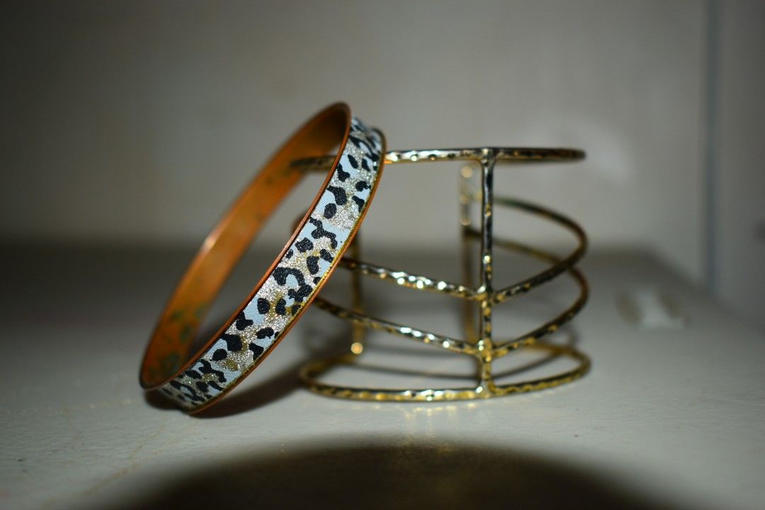Leopard print bangle and gold cuff (Category: Bracelets) located in Manila. Submitted by pinknalalaki (Listing ID 1465094528, Image 3). Description: 2000s leopard print bangle from my mom -200₱ gold cuff -250₱ 400 for both.