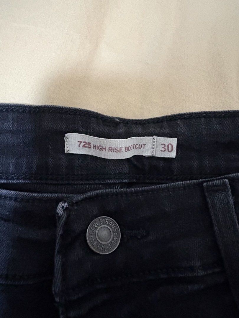 Levi's 725 High Rise Bootcut Jeans Size 30 (Category: Jeans) located in Quezon City. Submitted by bluefrenchorn (Listing ID 1465026138, Image 2). Description: - Brand: Levi's (725 High Rise Bootcut) - Color/Wash: Dark wash black denim - Size: Tagged size 30 - Measurements: ~13.5”waist across (flat lay), ~37.5” total length, rise 11 inches Stretchable - Details: Button closure with zip fly, classic 5-pocket design - Sustainability: Water Less prod