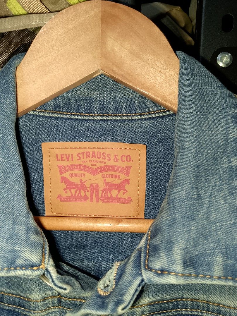 Levi's Light Wash Denim Jacket Size S (Category: Coats, Jackets and Outerwear) located in Manila. Submitted by mjthrifted_second (Listing ID 1465026270, Image 2). Description: - Brand: Levi's - Style: Denim jacket (Style 7747-M1C) - Color: Light wash - Size: Small (S) -Dimes: 17/21 - Material: 81% cotton, 18% polyester, 1% spandex - Features: Button-up front, classic collar, chest flap pockets, and side slip pockets - Condition: Clean denim fabri