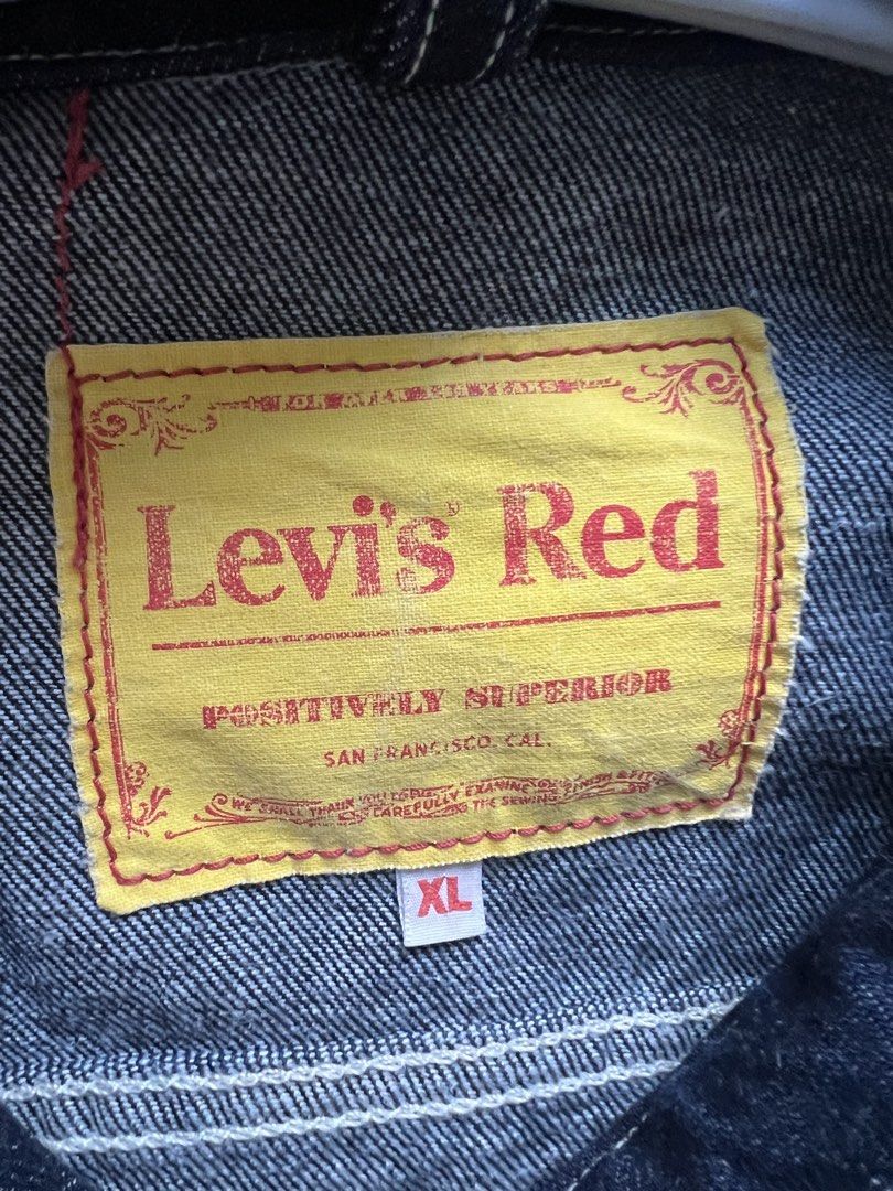 Levi's Red Positively Superior Denim Jacket XL (Category: Coats, Jackets and Outerwear) located in Manila. Submitted by russel_a (Listing ID 1465049095, Image 3). Description: - Brand: Levi's Red - Size: XL - Color/Wash: Dark wash denim with contrast stitching - Pockets: Multiple front utility pockets with flap closures - Details: Metallic buttons, iconic yellow interior brand label, and red tab on lower pocket - Style: Classic workwear silhouett