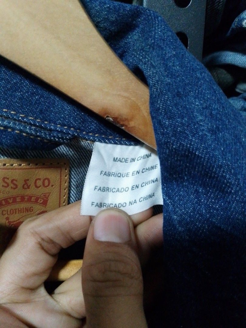 Levi's Two-Tone Denim Jacket Size S (Category: Coats, Jackets and Outerwear) located in Manila. Submitted by mjthrifted_second (Listing ID 1465024635, Image 3). Description: - Brand: Levi's - Style: Cool two-tone design (dark indigo top with lighter wash body and sleeves) - Size: Small (fits true to size) - Features: Button-up front, two buttoned chest pockets with iconic red tab, and vertical side welt pockets - Details: Levi's leather patch at 