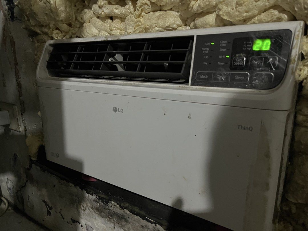 LG ThinQ Window Air Conditioner (Category: Air Conditioning and Heating) located in Manila. Submitted by bardsxs (Listing ID 1465092406, Image 1). Description: - Brand/Model: LG ThinQ Window Type Air Conditioner - Color: Clean White - Display & Controls: Digital temperature display (set at 20°C) with buttons for Mode, Timer, Sleep, and Fan Speed - Smart Features: Built-in Wi-Fi connectivity (indicator light active) - Air Direction: Adjustable lef