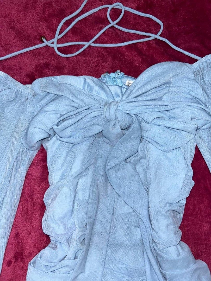 Light blue dress runched tie (Category: Dresses) located in Manila. Submitted by coolstuffs__ (Listing ID 1465162781, Image 3). Description: issue may stains lang kasi di nagamit natambak lang need lang labhan para mawala.