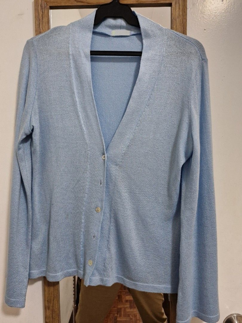 Light blue knit cardigan sweater button down (Category: Coats, Jackets and Outerwear) located in San Juan City. Submitted by lss88 (Listing ID 1464972237, Image 1). Description: - Color: Soft light blue - Design: V-neck with 4 front buttons - Fit: Relaxed, comfortable long sleeves - Texture: All-over knit - Styling: Great layering piece for cooler weather, easy to pair with jeans or skirts.