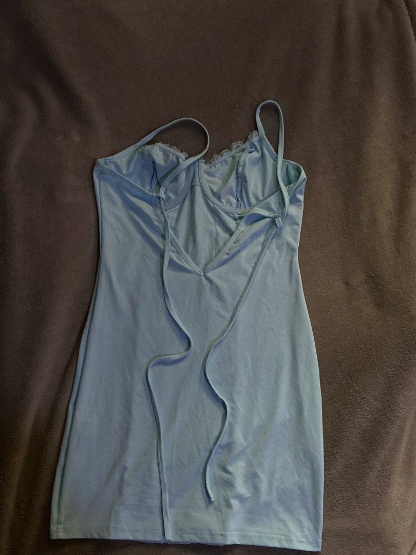 Light blue lace panel slip dress (Category: Dresses) located in Manila. Submitted by klokardaxh (Listing ID 1465168388, Image 2). Description: - Color: Light blue - Fit: Bodycon, mini length - Details: Underwire cups, floral lace center panel, low cut back with strap accents - Straps: Adjustable - Material: Soft jersey with good stretch - Condition: Excellent, clean with no stains or damage.