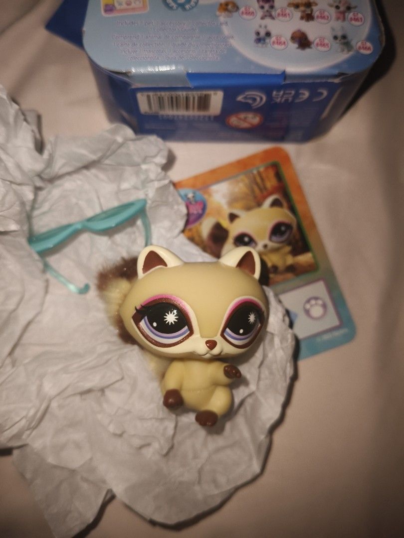 Littlest Pet Shop G7 #454 Blind Box Figure (Category: Designer & Blind Box Toys) located in Manila. Submitted by epiccloud-0597 (Listing ID 1465015313, Image 3). Description: - Brand: Hasbro (2025 Release) - Item: Littlest Pet Shop Generation 7, Figure #454 - Features: Fluffy brown and cream tail, blue sunglasses accessory - Inclusions: Character collector card included - Condition: Brand new, stored in original blind box packaging - 100% authent