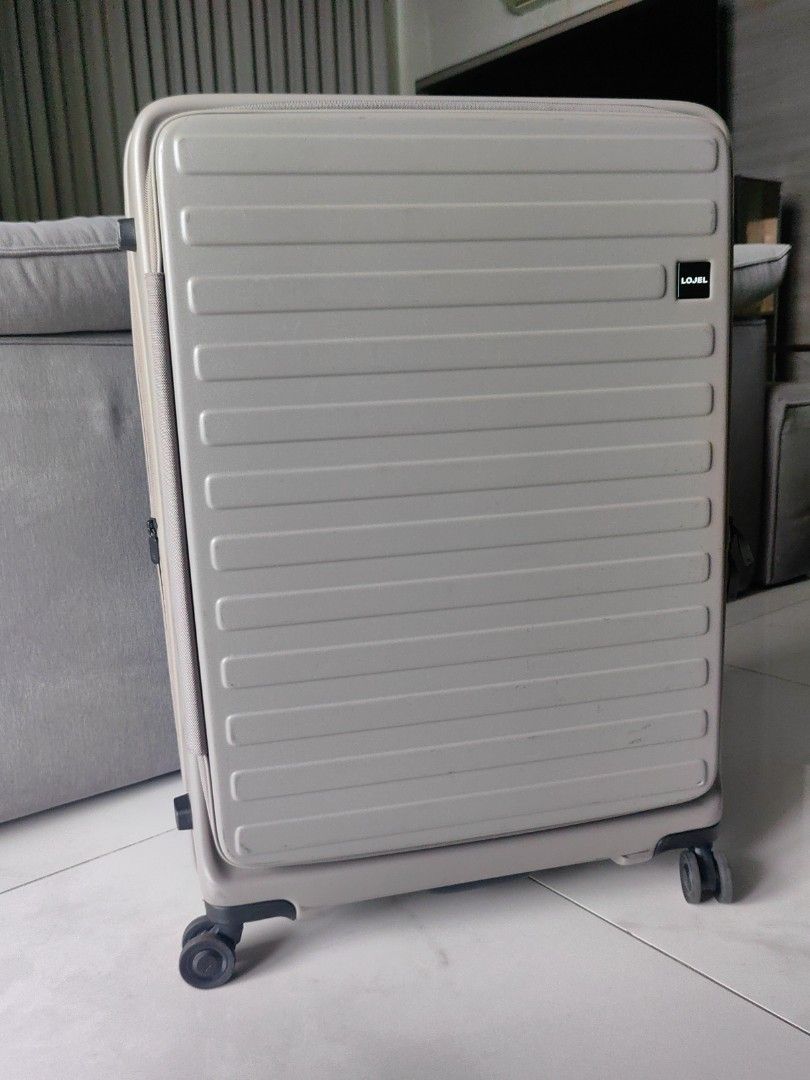 LOJEL grey hard-shell luggage suitcase with TSA lock (Category: Luggage) located in Makati City. Submitted by kruelscloset (Listing ID 1464989002, Image 1). Description: LOJEL hard-shell luggage in grey. Includes a built-in TSA combination lock and smooth rolling wheels. Solid carry capacity for trips. Normal scuffs from travel use, everything works properly..