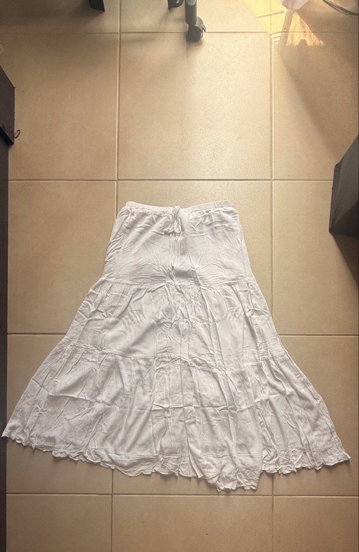 Long White Tiered Skirt (Category: Skirts) located in Makati City. Submitted by chie_3030 (Listing ID 1465000285, Image 1). Description: Size Reference: height: 5’4” waist: 28in Listed Item: - white - long skirt - tiered skirt - not sheer - with long inner lining - garterized waist.