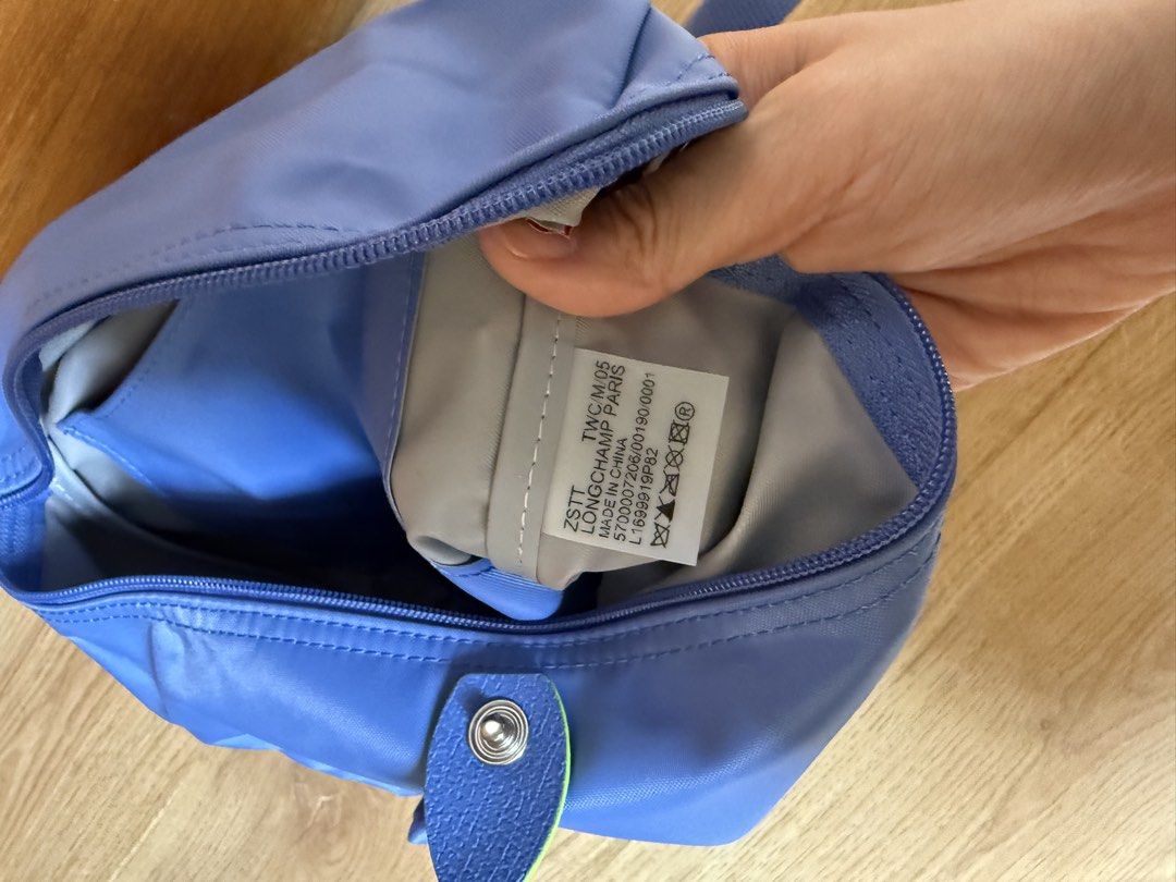 Longchamp Le Pliage Sac A Dos Backpack Blue (Category: Backpacks) located in Cebu City. Submitted by limjennif52235 (Listing ID 1464980039, Image 3). Description: - Authentic Longchamp Le Pliage Backpack - Color: Blue (Nylon with leather trim) - Features: Top handle, adjustable straps, snap button & zip closure with circular logo pull - Interior: Fabric lining with brand tag details - Origin: Made in China - Condition: Clean, includes protective 