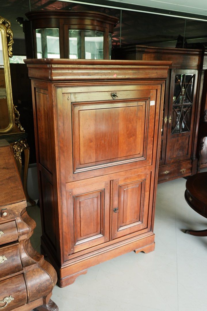 Louis Philippe-Style Fall Front Writing Cabinet (Category: Office Furniture & Fixtures) located in Manila. Submitted by heleensym (Listing ID 1464970708, Image 2). Description: An elegant writing cabinet with a warm wood finish and understated panelled detailing. The front lowers to reveal a green inset writing surface and a contrasting pale figured interior fitted with four small drawers and open storage compartments. A double-door cupboard belo