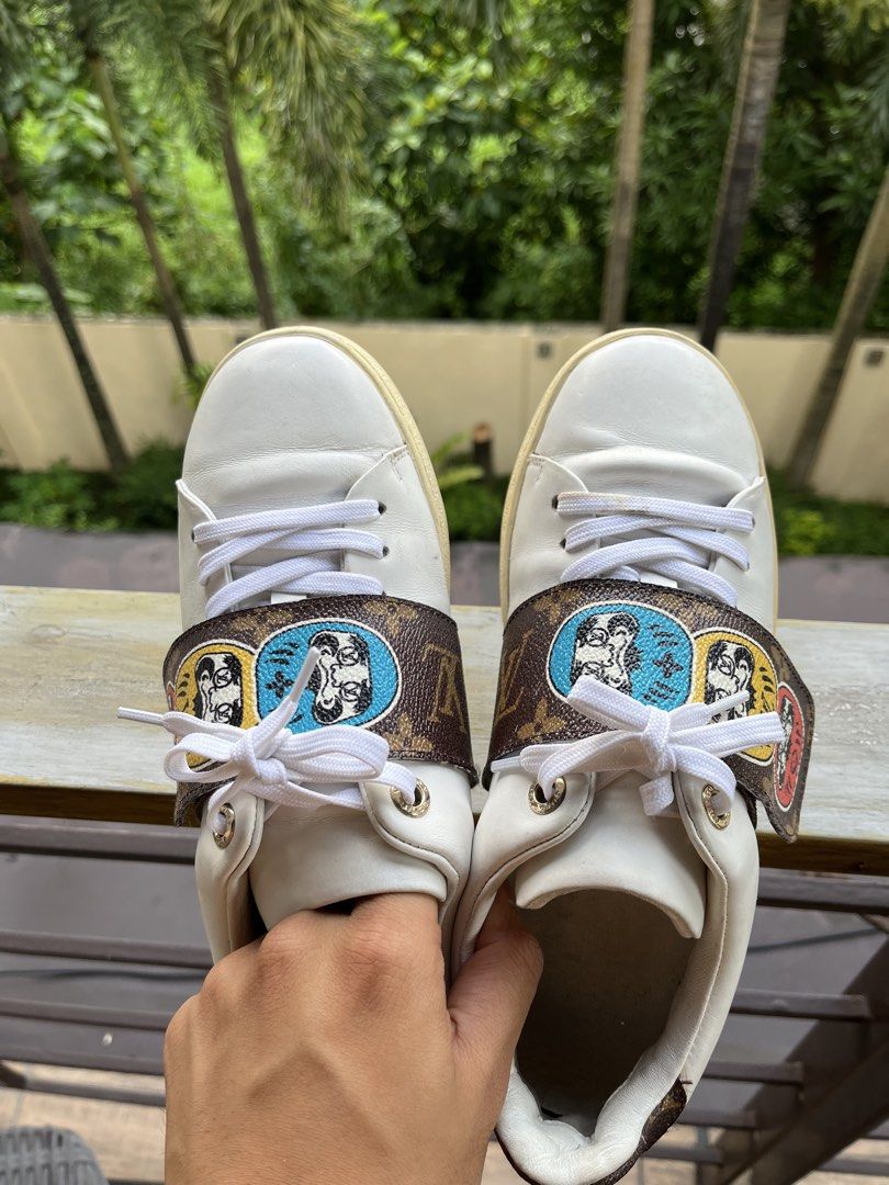 Louis Vuitton Monogram Patch Sneakers White (Category: Sneakers) located in Manila. Submitted by tanfinds (Listing ID 1464986675, Image 3). Description: - Brand: Louis Vuitton - Color: White with colorful mascot monogram strap - Style: Classic low-top leather sneakers - Details: Embossed logo on side and heel counter - Condition: Clean uppers with light toe creasing; moderate dirt on white rubber soles from walking - Inclusions: Original white la